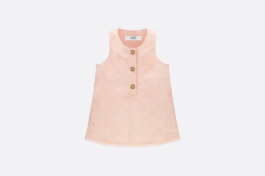 Wear a straight link skirt.  Peach cotton tarpaulin with light gold Cannage rattan case and star printing.  Numbering: 3SBM32DRSF_Y308